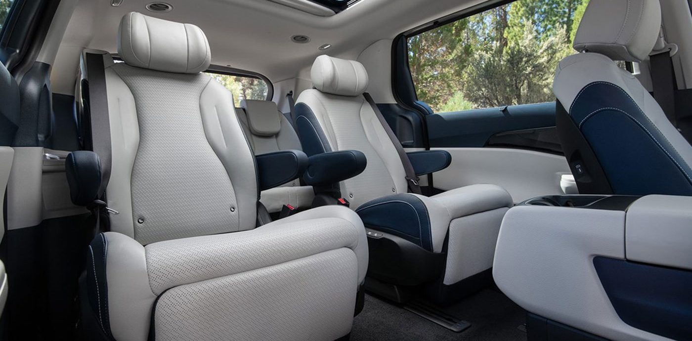 The Kia Carnival Hybrid Navy leather interior seating 2nd row Captain Chairs.