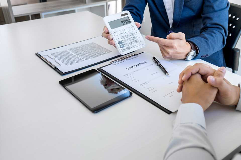 Going through down payment, term length and monthly figures with the Scarboro Kia finance team