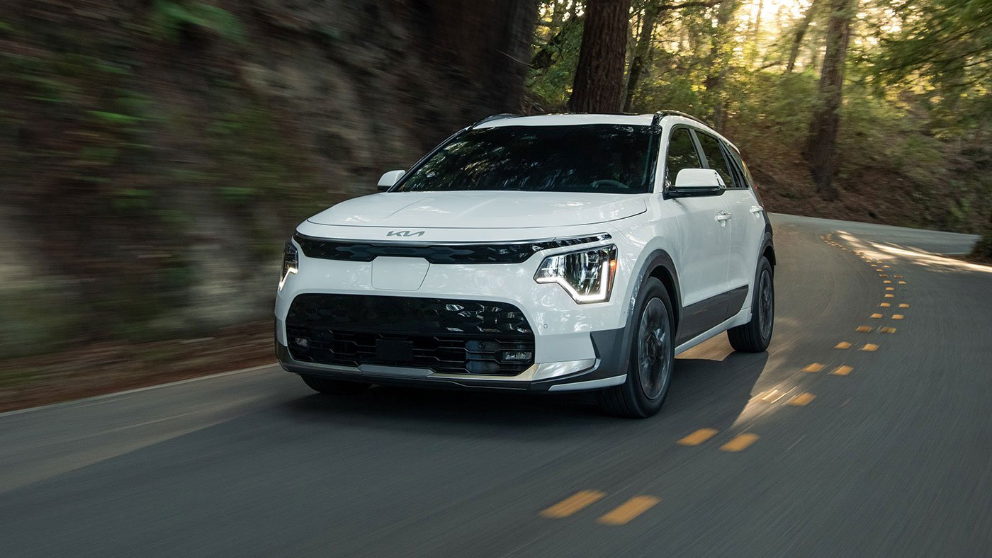 2025 Kia Niro EV driving with up to 407 km of electric range