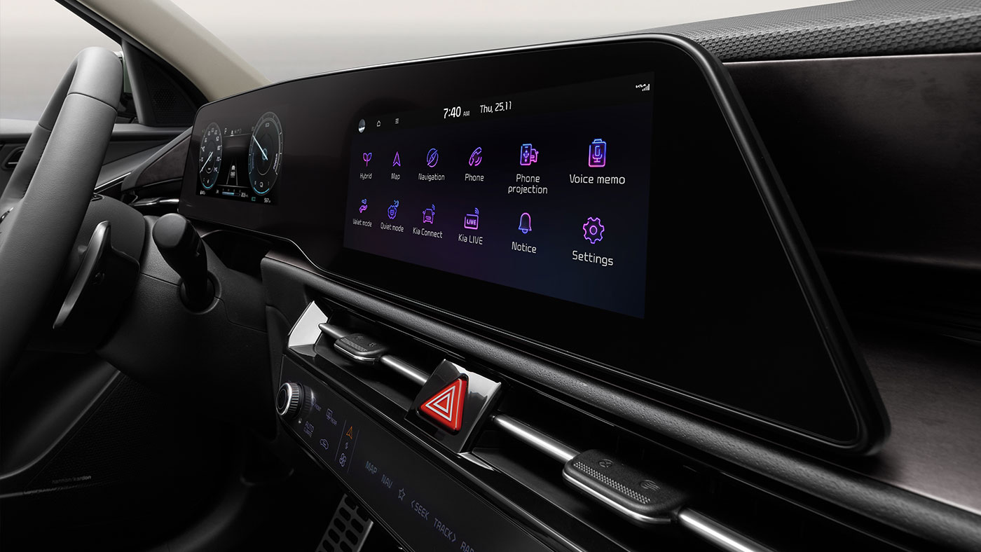 Front exterior of Niro Hybrid SX in Cityscape Green driving.